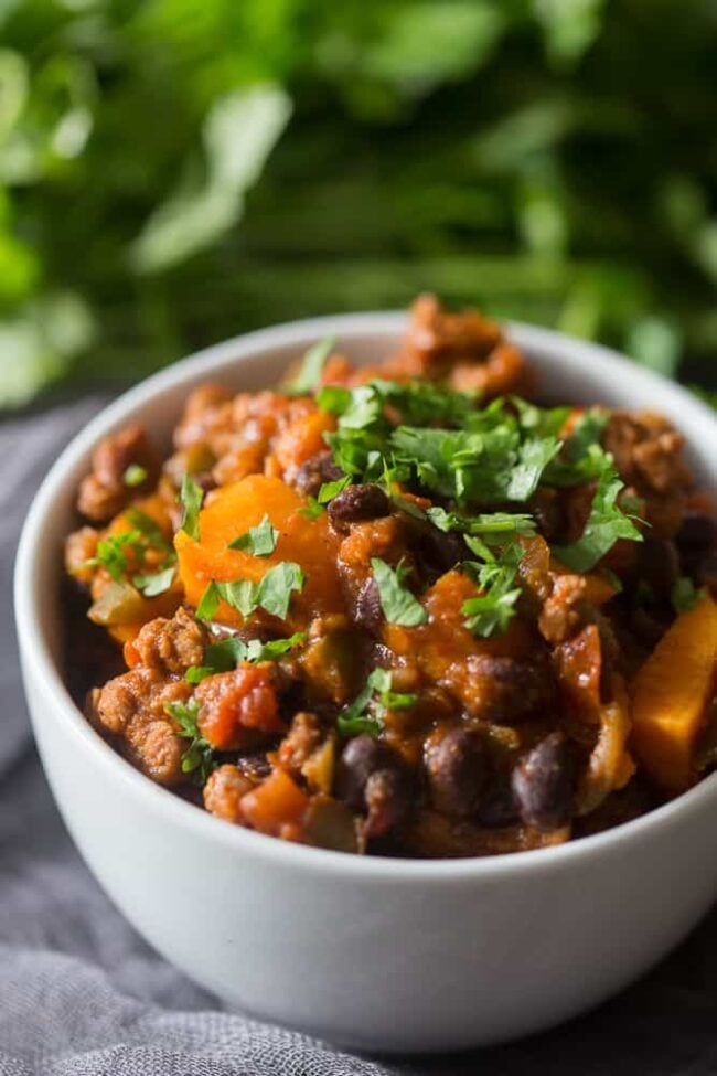 This spicy chorizo sweet potato black bean chili is ready in just 30 minutes and is packed full of hearty deliciousness. Top with cilantro and call it dinner!